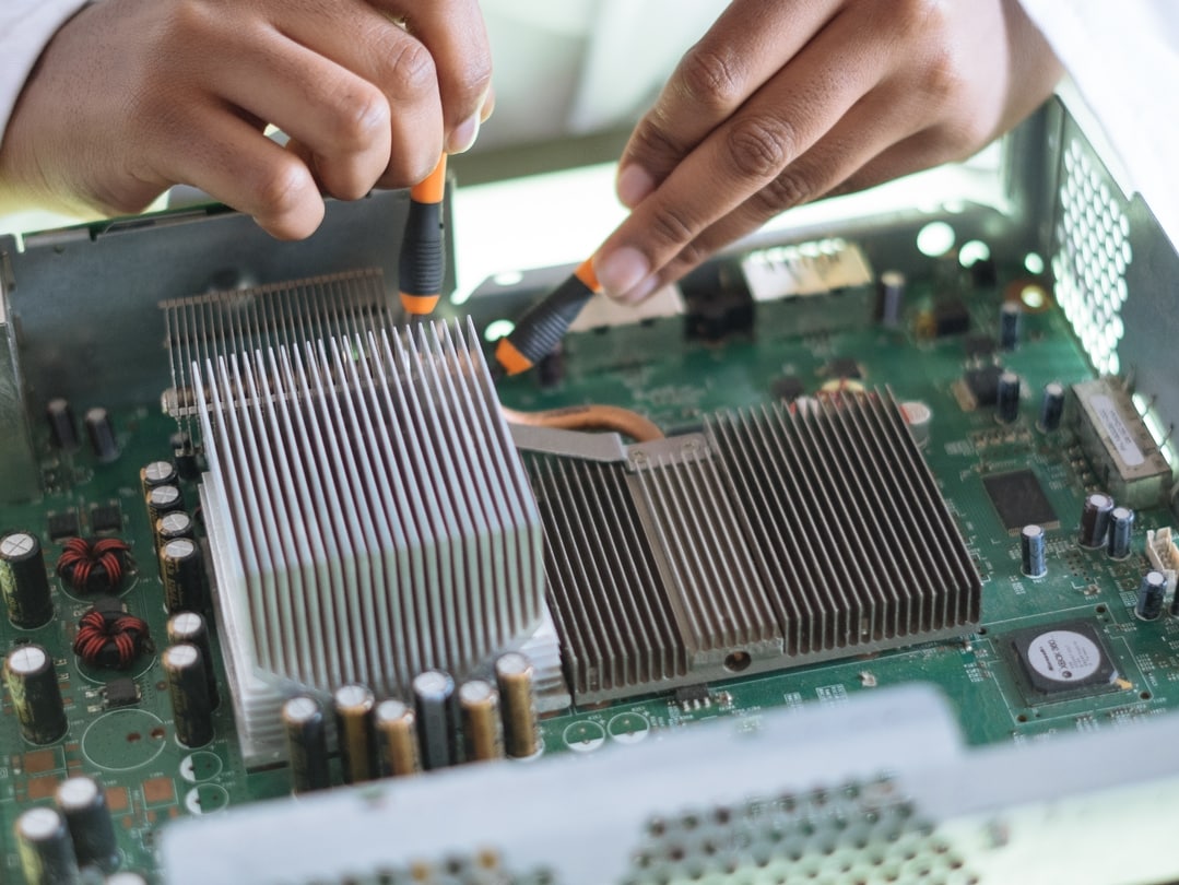 Person Working on Circuit Board